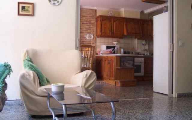 Kitchen and living room in a shared apartment near the school